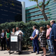 Charles Johnson IV, center, surrounded by his legal team and other supporters during a press conference outside Cedars-Sinai Medical Center, May 4, 2022, in Los Angeles.